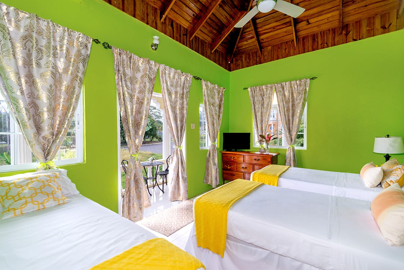 Jamaica villa twin bedroom with ocean view from balcony